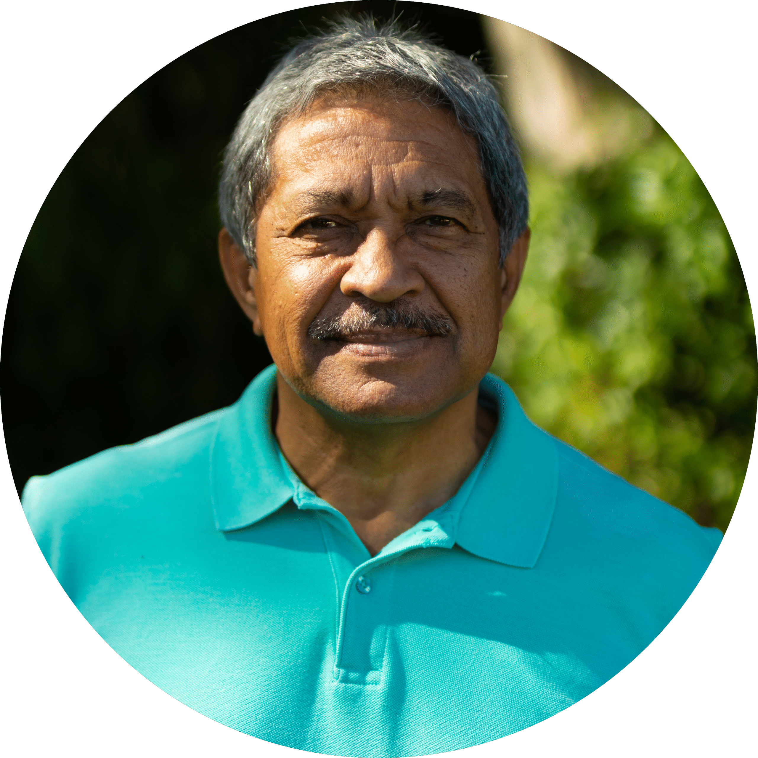 portrait smiling biracial senior man wearing blue t shirt with gray hair standing park copy
